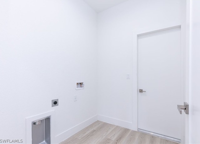 laundry area featuring light hardwood / wood-style floors, hookup for a washing machine, and hookup for an electric dryer