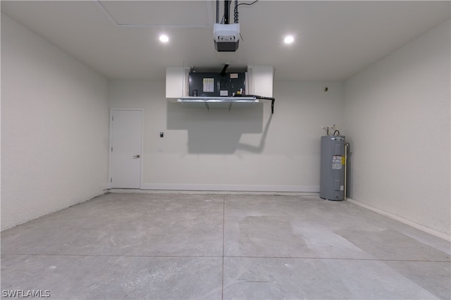 garage with electric water heater and a garage door opener