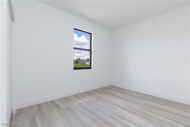 unfurnished room featuring light hardwood / wood-style floors