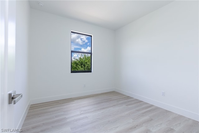 unfurnished room with light hardwood / wood-style flooring