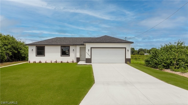 ranch-style home with a garage and a front yard