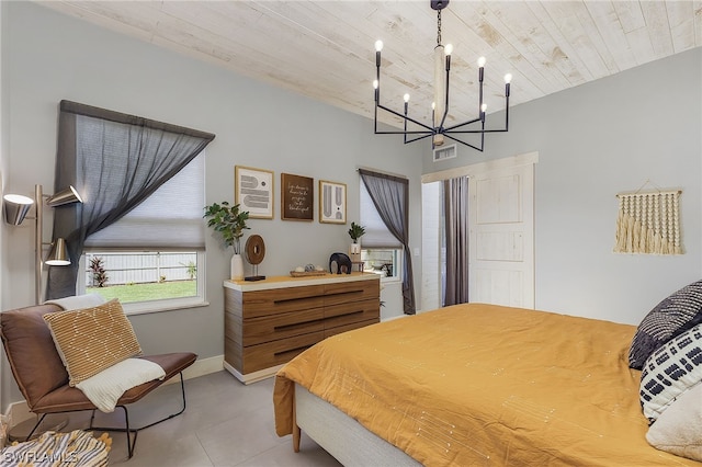 tiled bedroom with wood ceiling and an inviting chandelier