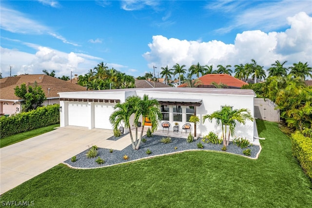 view of front facade with a garage and a front yard