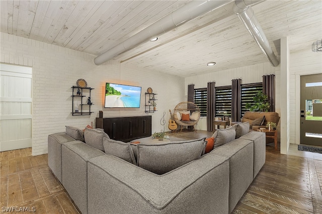 living room featuring wooden ceiling, wood-type flooring, and brick wall