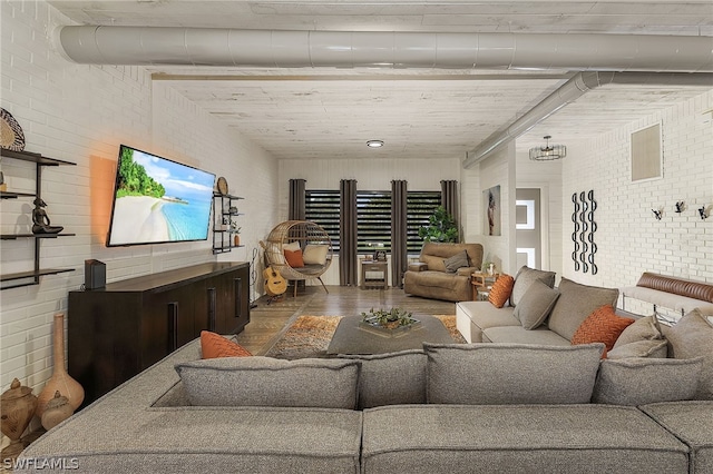 living room featuring brick wall