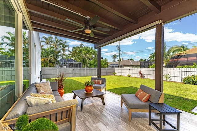 view of patio with ceiling fan and an outdoor living space