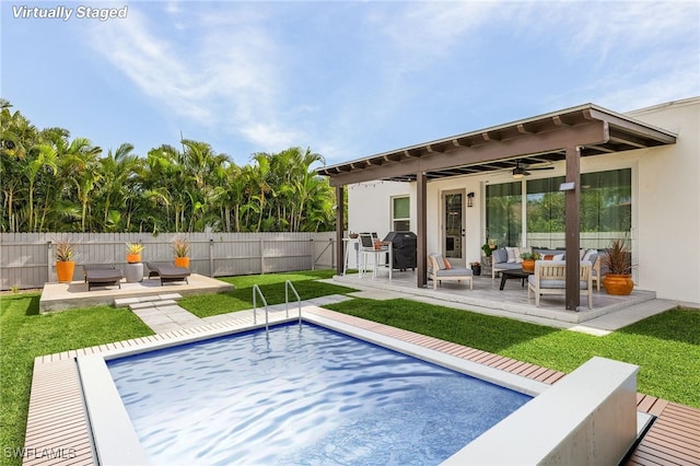 view of pool with an outdoor hangout area, a pergola, a patio, ceiling fan, and a yard