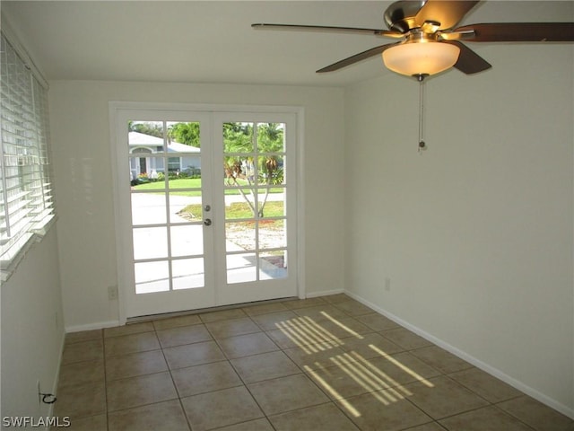 tiled empty room with french doors