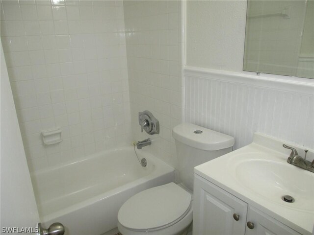 full bathroom featuring vanity, toilet, and tiled shower / bath combo