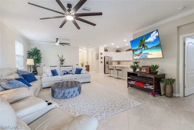 tiled living room featuring ornamental molding and sink