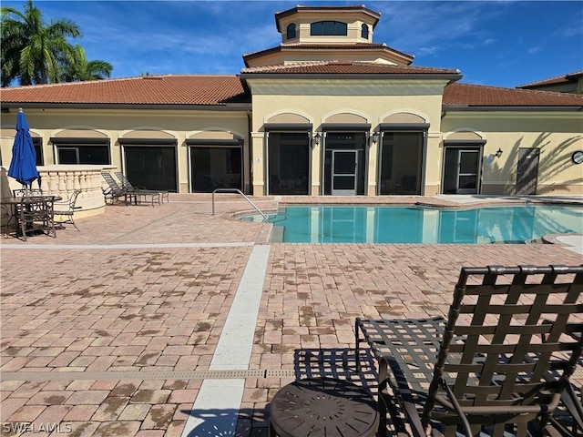 12940 Positano Cir Unit 201, Naples, FL 34105 - community pool featuring a patio area