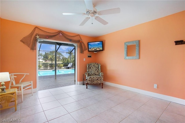 unfurnished room with ceiling fan and light tile patterned flooring