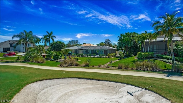 view of home's community featuring a lawn