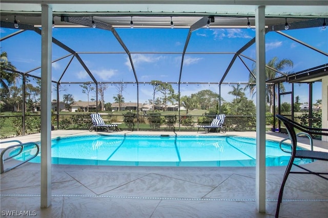 view of pool featuring a lanai and a patio area