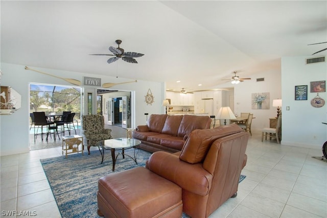 tiled living room featuring lofted ceiling and ceiling fan