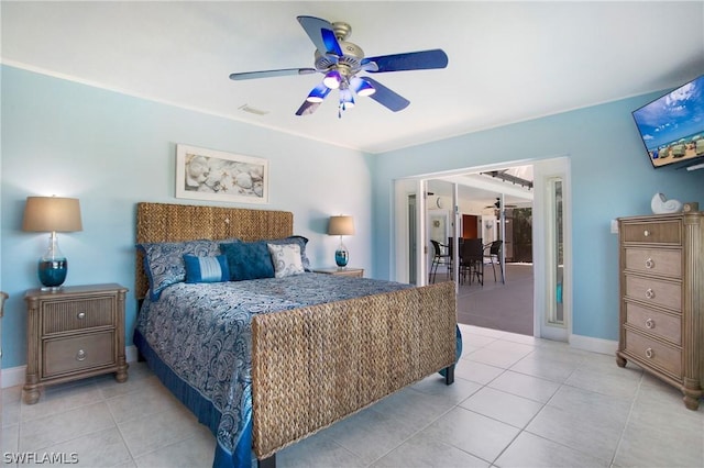 tiled bedroom featuring ceiling fan