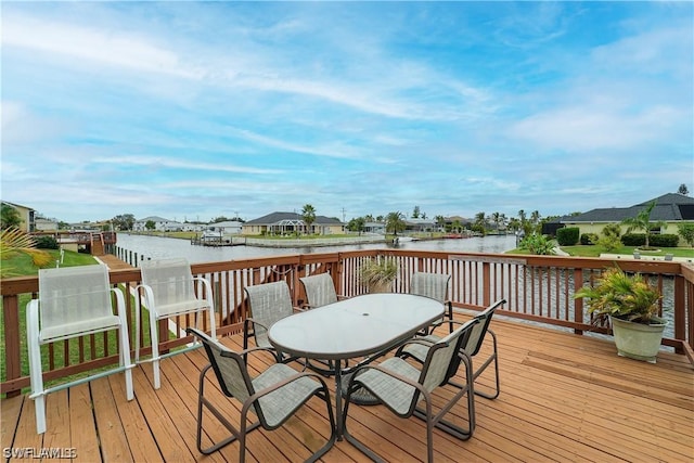 wooden terrace featuring a water view