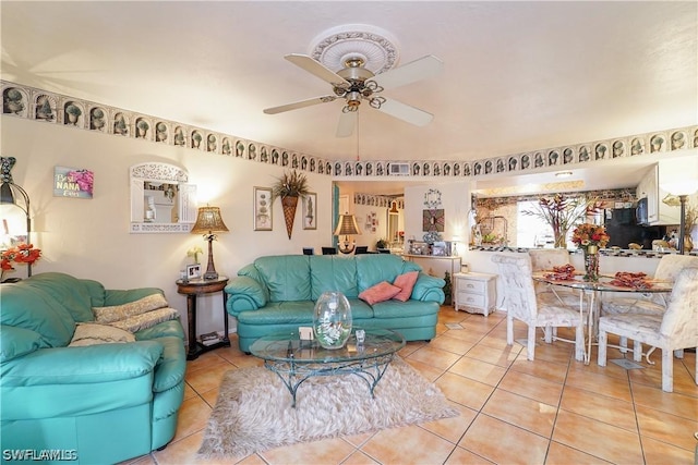 tiled living room with ceiling fan