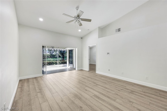 spare room with a ceiling fan, light wood-type flooring, visible vents, and baseboards