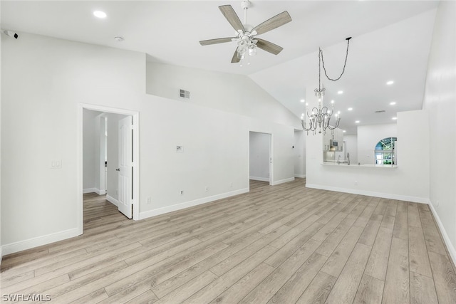 unfurnished living room featuring visible vents, baseboards, light wood-style flooring, vaulted ceiling, and ceiling fan with notable chandelier