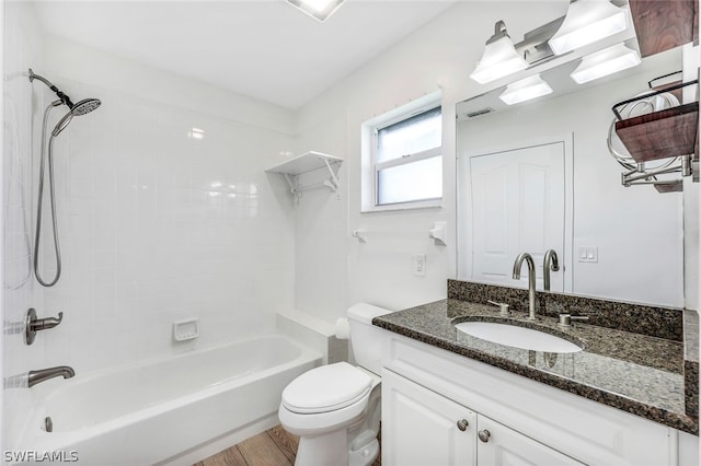 full bathroom featuring toilet, tub / shower combination, wood finished floors, and vanity