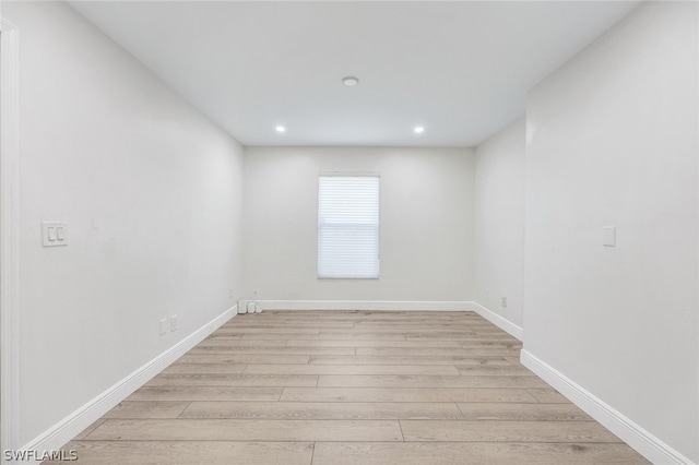 unfurnished room featuring light hardwood / wood-style floors