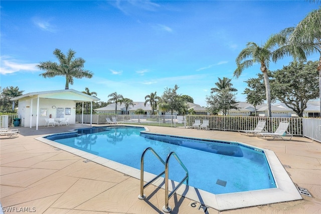 pool featuring a patio and fence