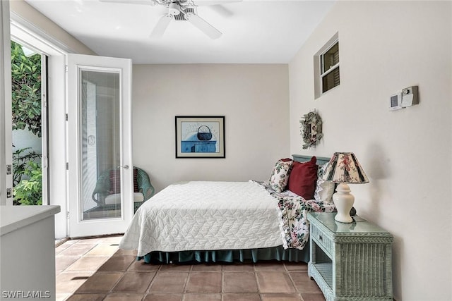 bedroom with access to outside, ceiling fan, and tile patterned flooring