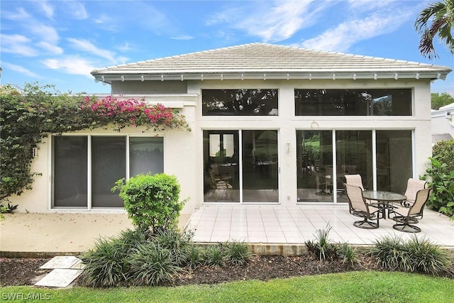 back of property featuring a patio area