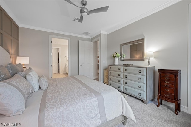 bedroom featuring connected bathroom, light carpet, ceiling fan, and ornamental molding