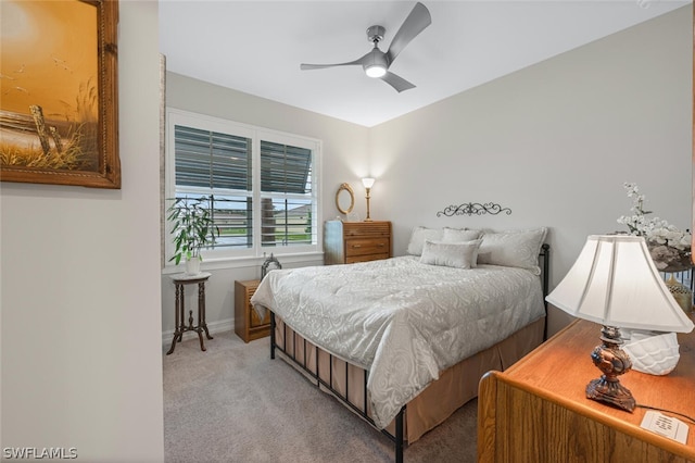 bedroom with ceiling fan and light colored carpet