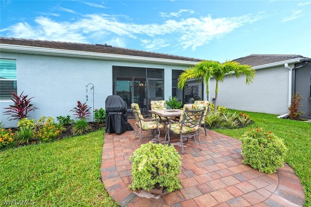 view of patio with a grill