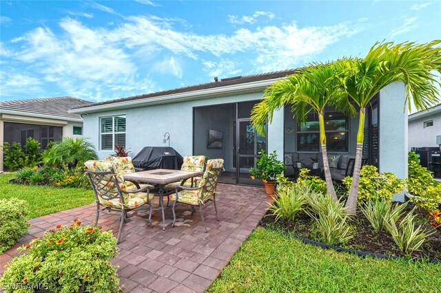 view of patio with a sunroom