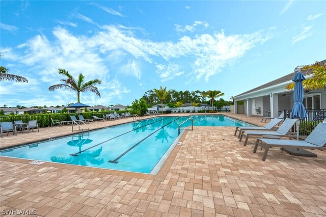 view of swimming pool featuring a patio