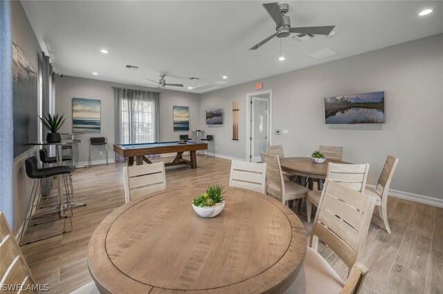 dining area featuring ceiling fan, billiards, and light hardwood / wood-style floors