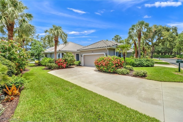 3357 Wildwood Lake Cir, Bonita Springs, FL 34134 - ranch-style house with a garage, stucco siding, a front lawn, and a tile roof