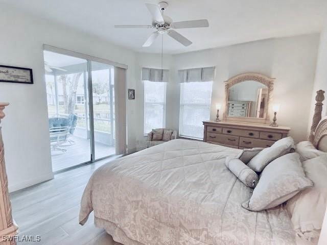 3357 Wildwood Lake Cir, Bonita Springs, FL 34134 - bedroom featuring light wood-style floors, access to exterior, and a ceiling fan