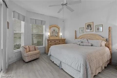 bedroom featuring ceiling fan and light hardwood / wood-style flooring