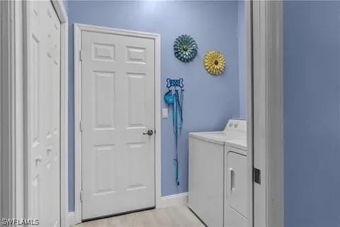 laundry room with washing machine and clothes dryer