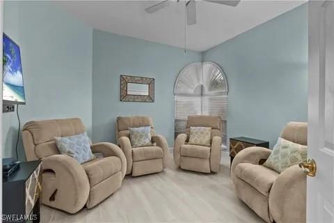 living area featuring ceiling fan