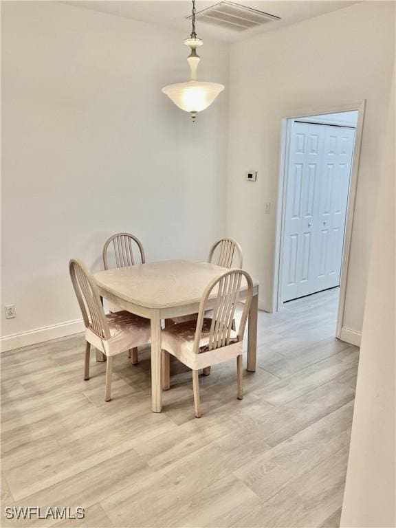 3357 Wildwood Lake Cir, Bonita Springs, FL 34134 - dining space with light wood finished floors, baseboards, and visible vents