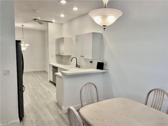 3357 Wildwood Lake Cir, Bonita Springs, FL 34134 - kitchen featuring a sink, light wood-type flooring, freestanding refrigerator, a ceiling fan, and stainless steel dishwasher