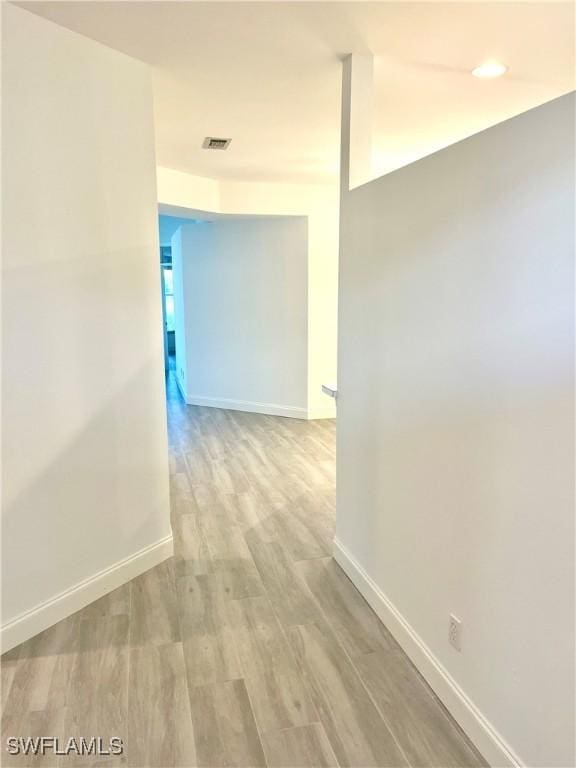 3357 Wildwood Lake Cir, Bonita Springs, FL 34134 - hall featuring visible vents, baseboards, and wood finished floors