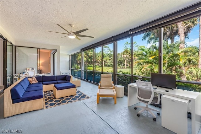 sunroom with ceiling fan