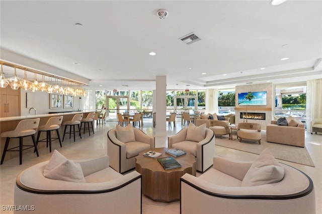 living room with a tray ceiling