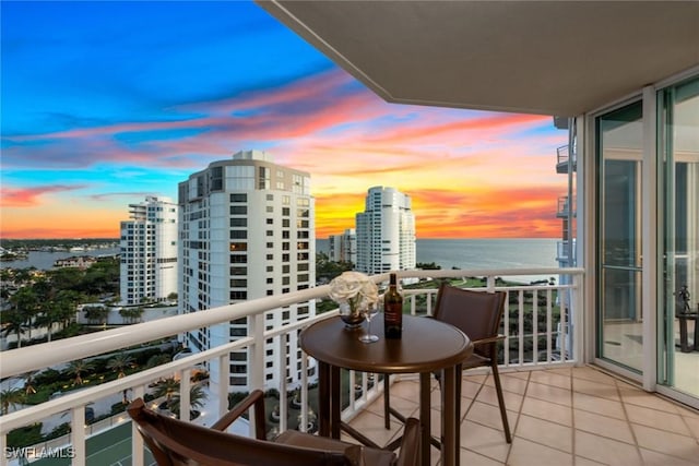 balcony at dusk with a water view