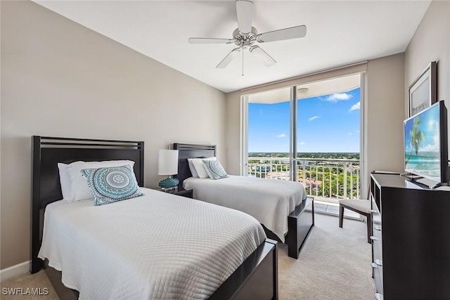 bedroom featuring ceiling fan, a wall of windows, access to outside, and light carpet