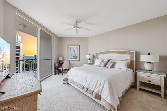 bedroom featuring ceiling fan, access to exterior, and light colored carpet