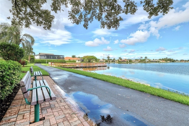 surrounding community with a water view