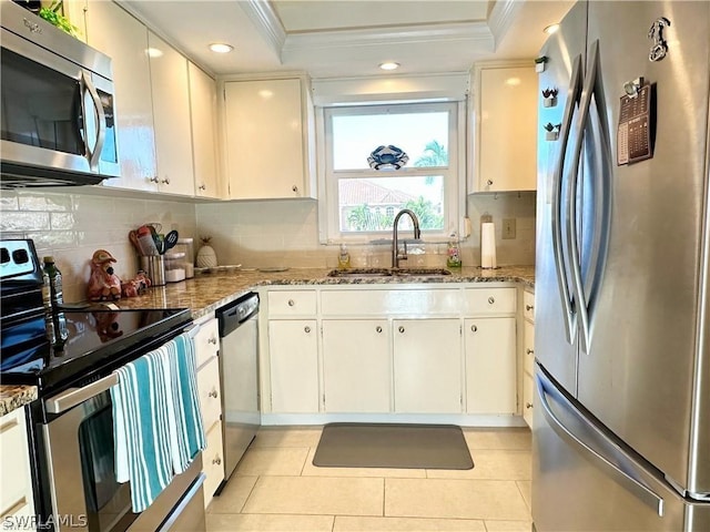 4563 SE 5th Pl Unit 205, Cape Coral, FL 33904 - kitchen with crown molding, a sink, light stone countertops, stainless steel appliances, and decorative backsplash